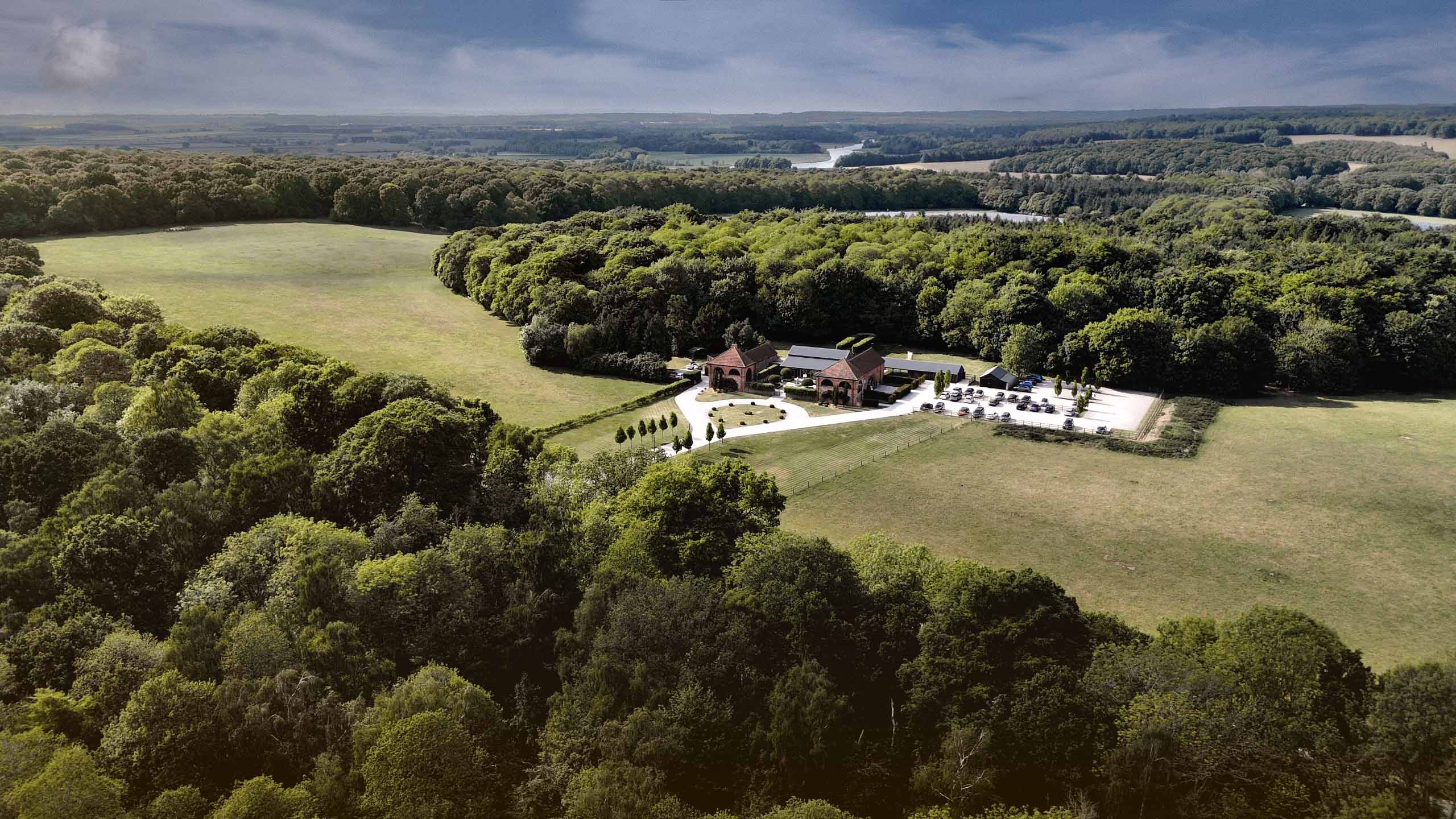 Drone shot of Hazel Gap Barn wedding venue and the surrounding countryside