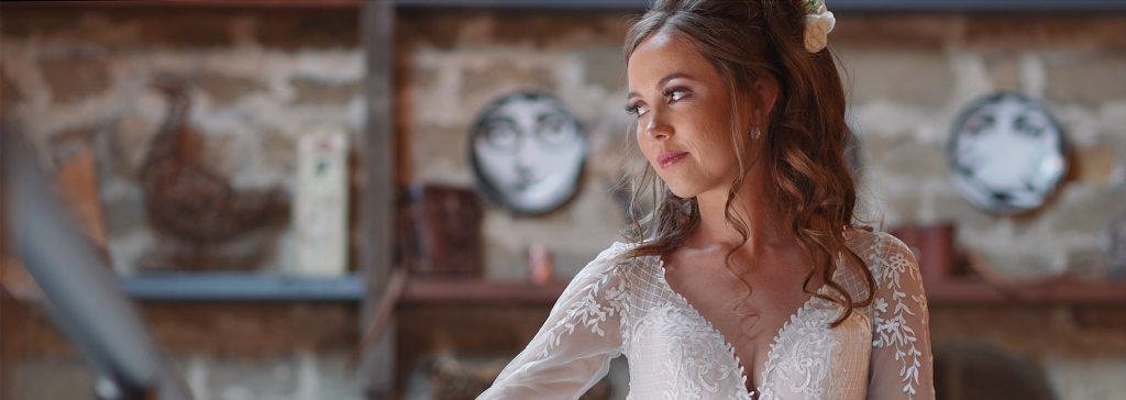 Bride posing in natural light of hallway in Wharfedale Grange venue