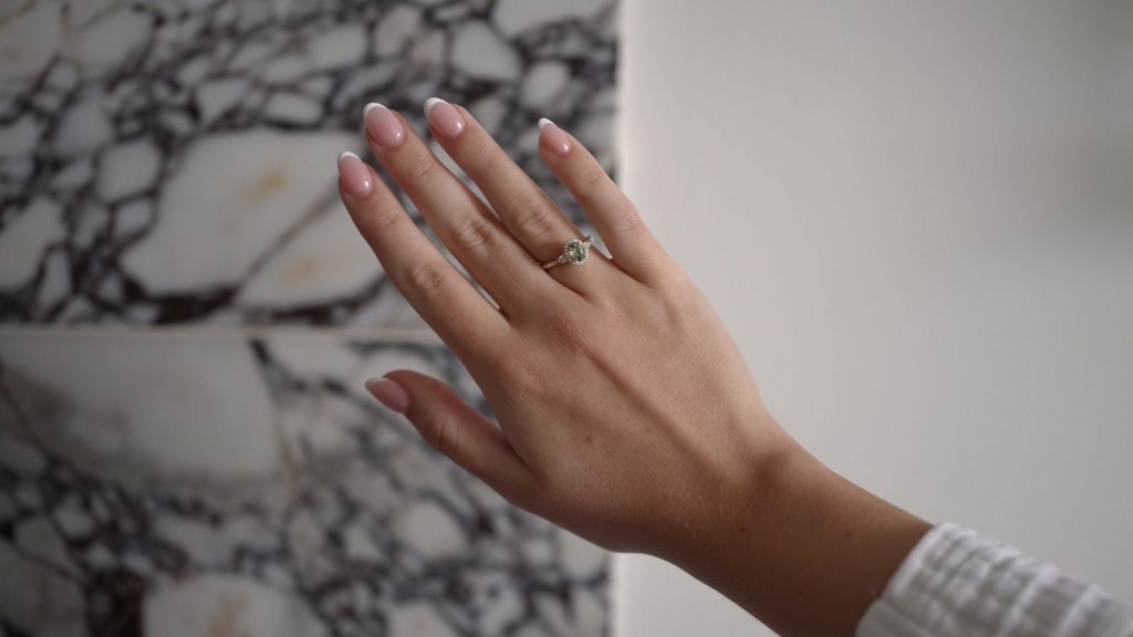 Brides hand showing her engagement ring